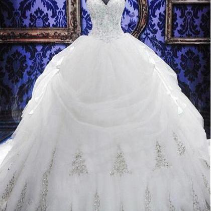 Elegant White Sweetheart Crystal Ball Gown Wedding..