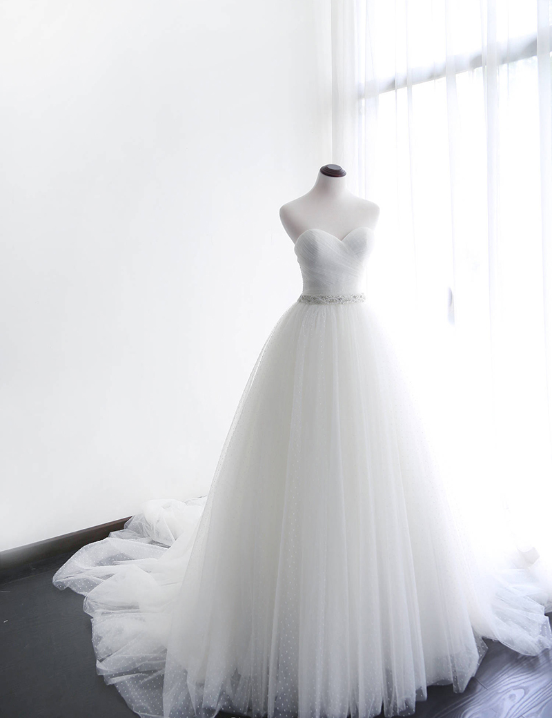 Strapless Sweetheart Ruched Beaded Tulle Ball Gown Wedding Gown Featuring Long Chapel Train
