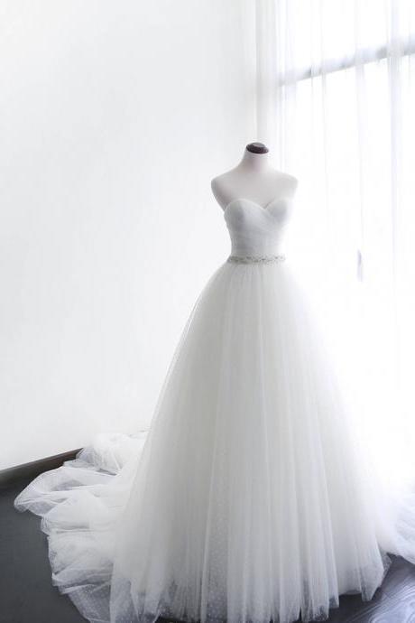Strapless Sweetheart Ruched Beaded Tulle Ball Gown Wedding Gown Featuring Long Chapel Train